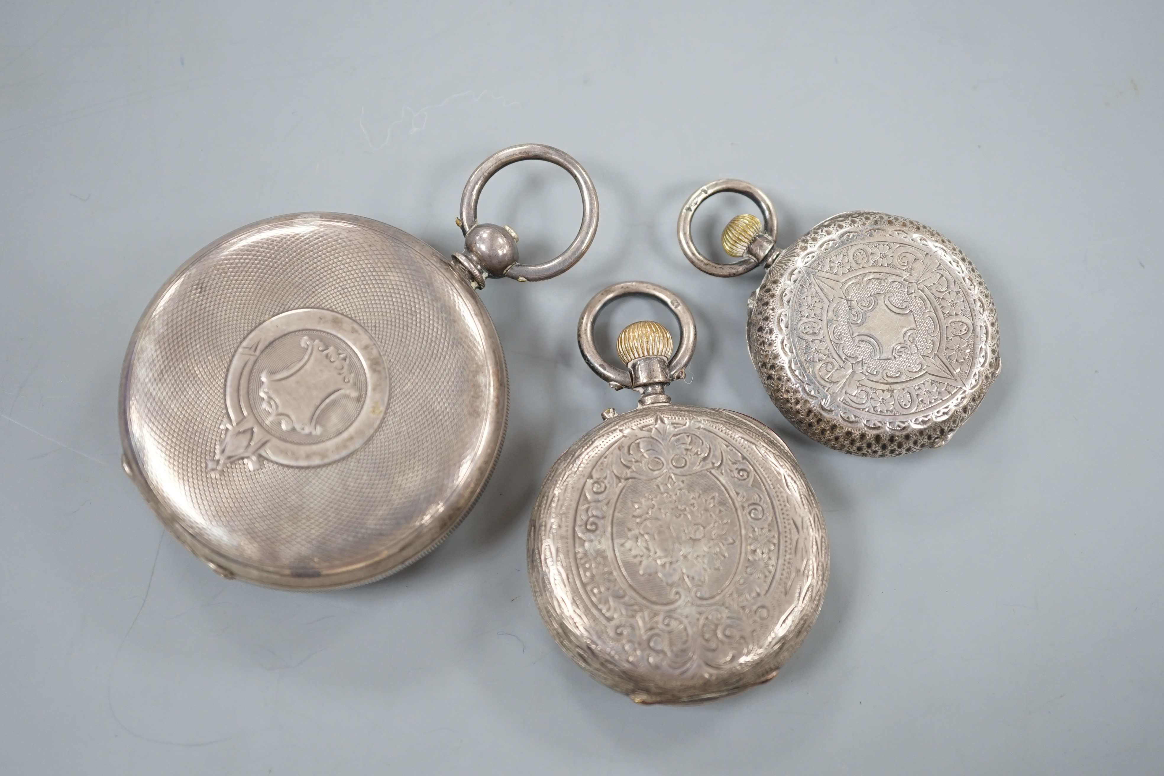 A Swiss 935 white metal open faced pocket watch and two fob watches=, silver a 935 white metal.